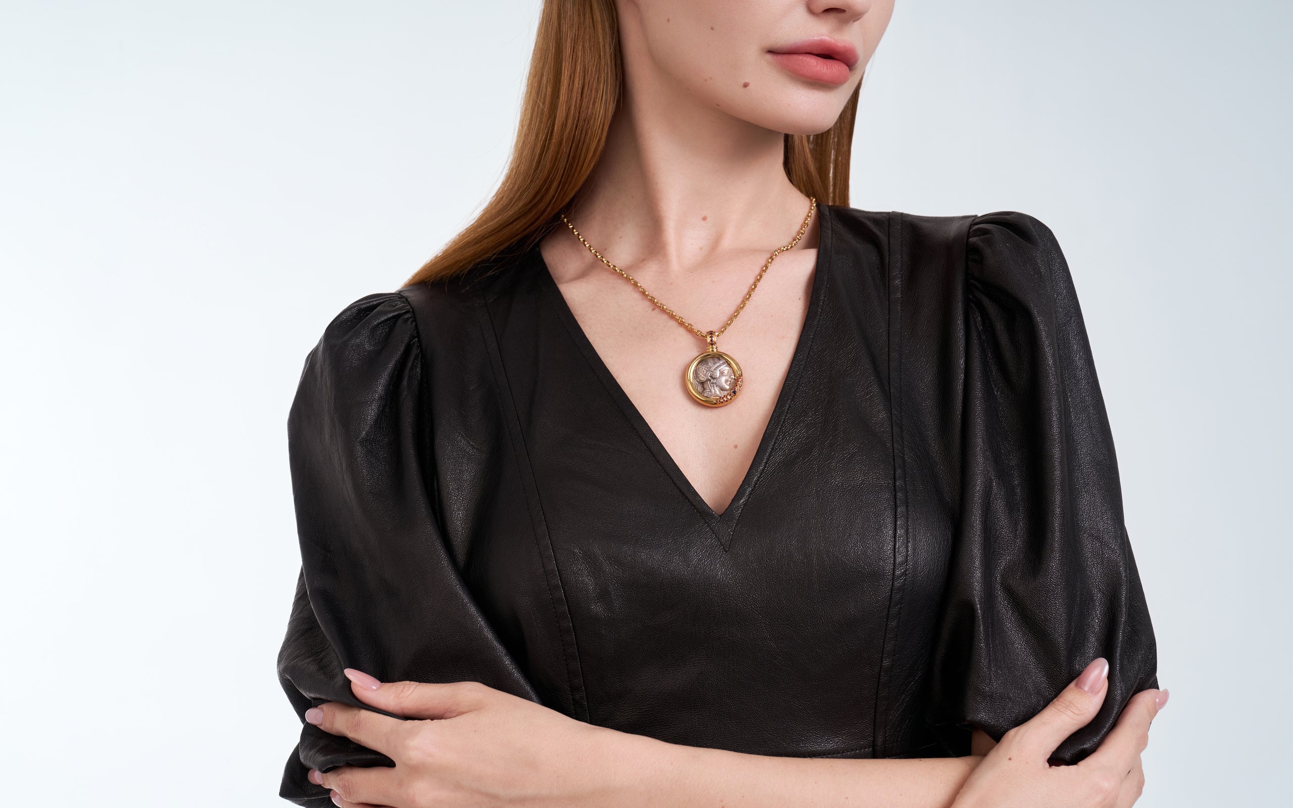 HERITAS ancient coin pendant worn with black leather