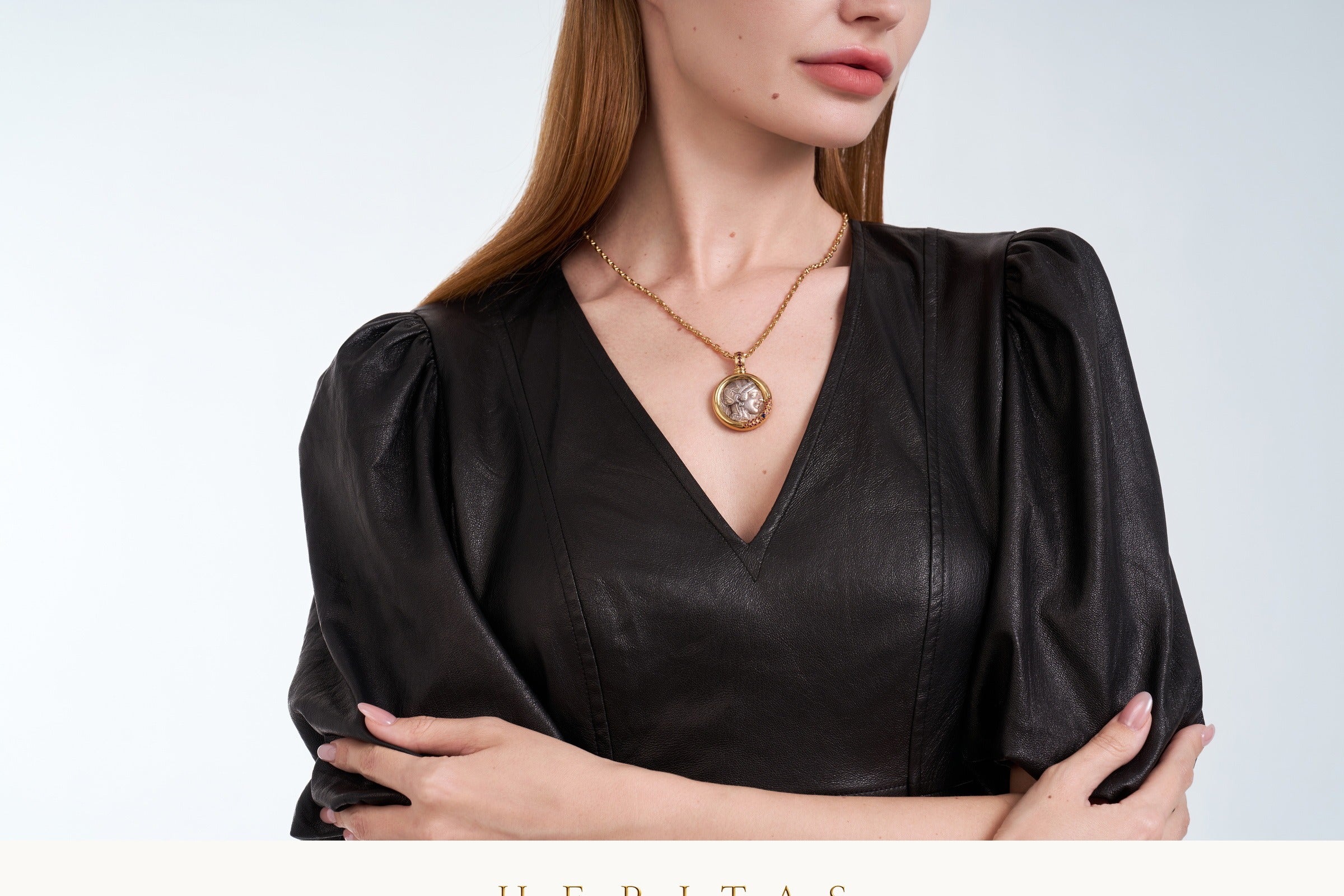 HERITAS ancient coin pendant worn with black leather